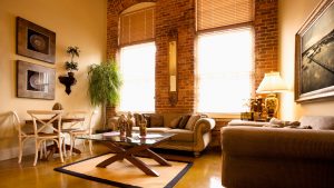 hot house with sun shining through the windows, making the room much hotter