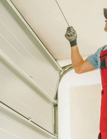 Repairman working on a garage door