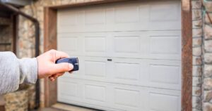 man unlocking garage door