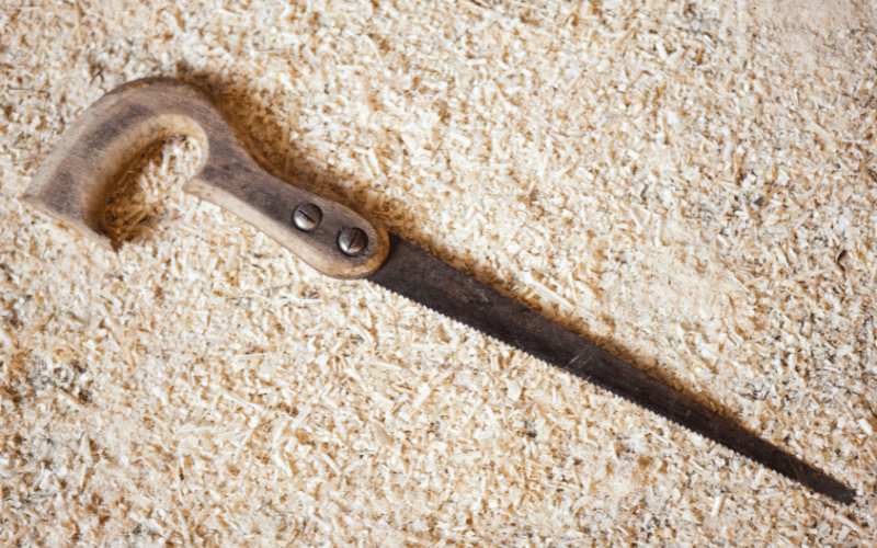 compass saw on saw dust