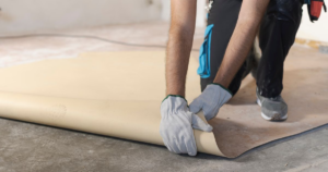 Contractor working with linoleum floor