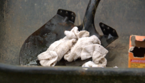 Closeup of a shovel with a cloth on it